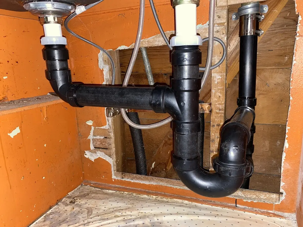 Professional Garbage Disposal Repair equipment and tools on the job in Watertown